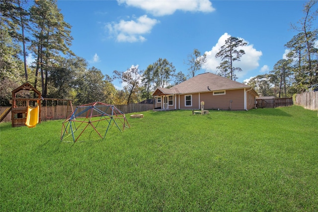 12466 Royal Lake Dr, Conroe, TX 77303 - view of yard with a playground and a fenced backyard