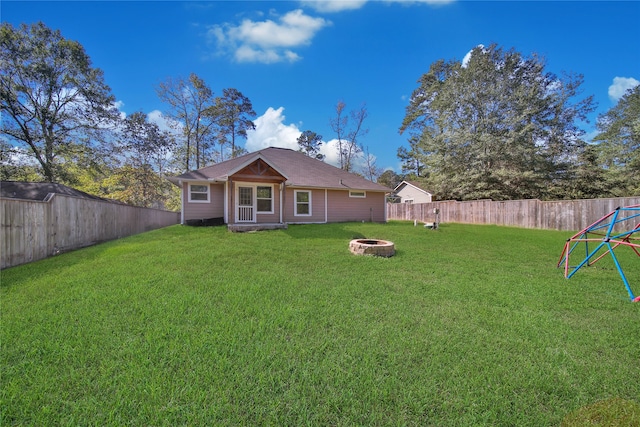 view of yard with an outdoor fire pit