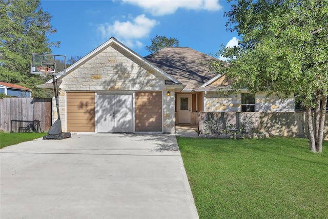 12466 Royal Lake Dr, Conroe, TX 77303 - view of front of house featuring driveway, stone siding, fence, an attached garage, and a front yard