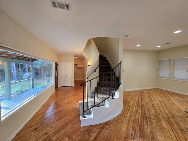 stairway featuring hardwood / wood-style floors