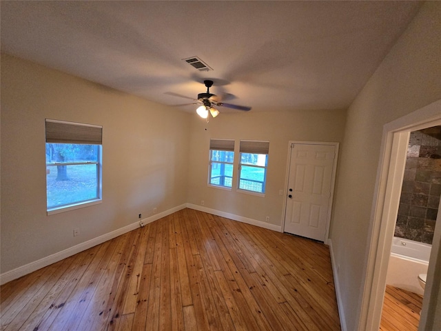 entrance foyer with ceiling fan and light hardwood / wood-style flooring