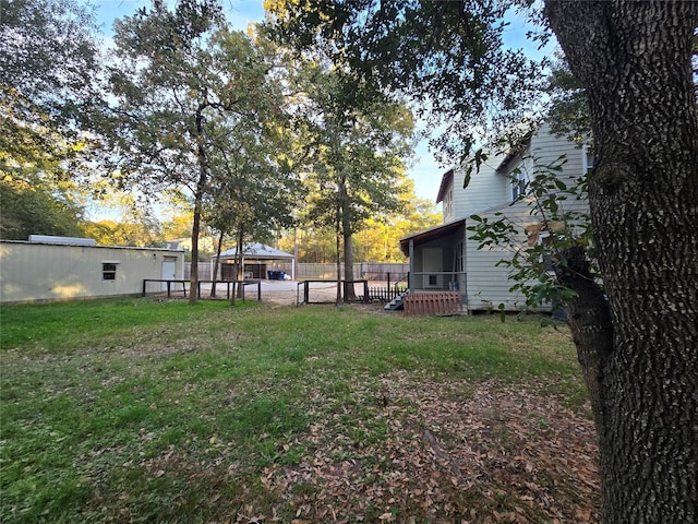 view of yard featuring a sunroom