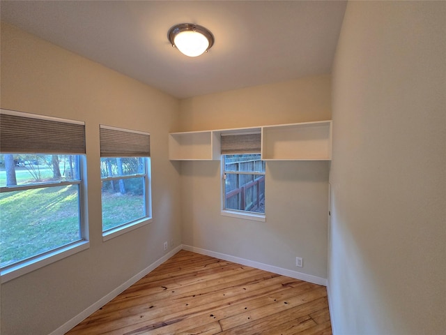 spare room with light hardwood / wood-style flooring