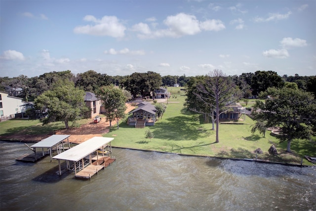 birds eye view of property with a water view