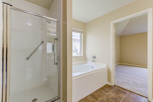 bathroom with tile patterned flooring and plus walk in shower