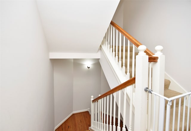 staircase featuring hardwood / wood-style flooring