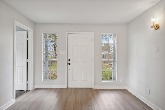 foyer entrance with light wood-type flooring