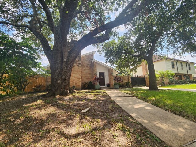 view of property exterior featuring a lawn