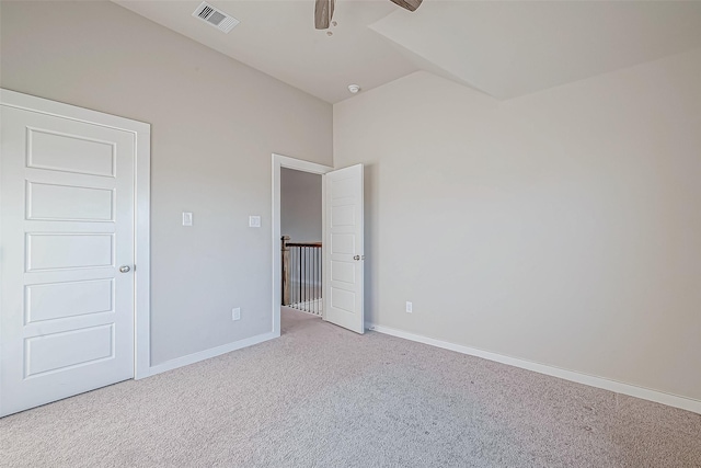 unfurnished bedroom with ceiling fan and light colored carpet