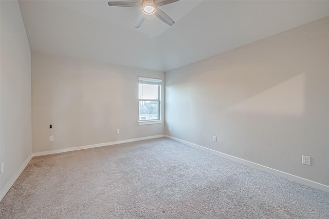 spare room featuring ceiling fan and carpet floors