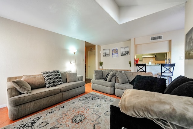 living room with tile patterned floors