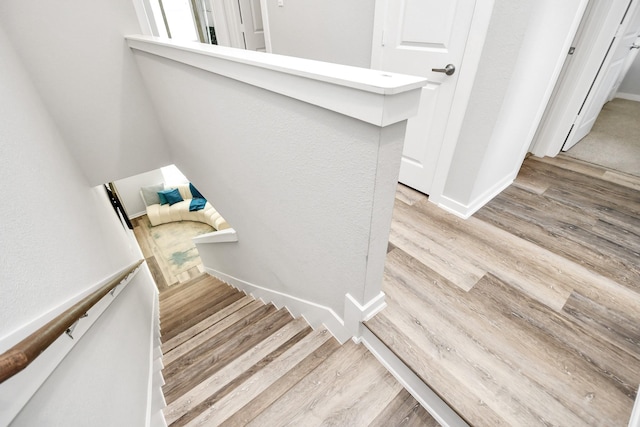 stairway featuring hardwood / wood-style floors