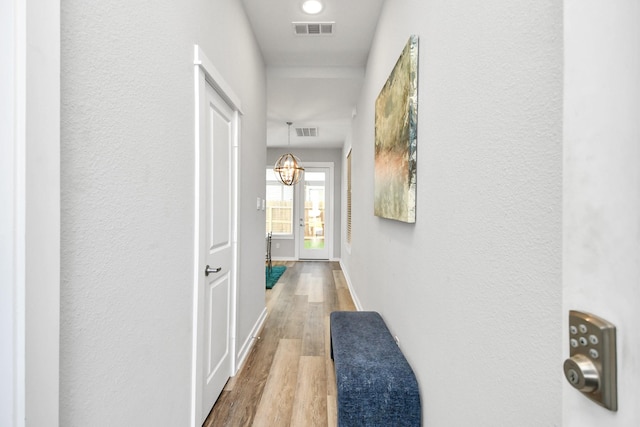 hallway with wood-type flooring