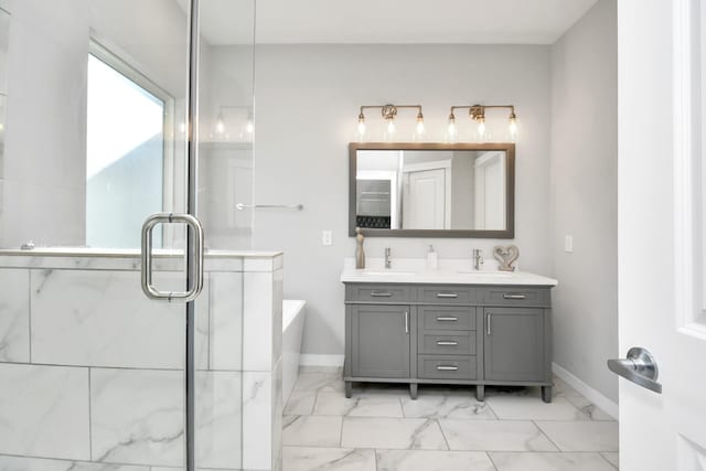 bathroom featuring vanity and a tub