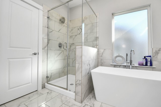 bathroom featuring sink and independent shower and bath