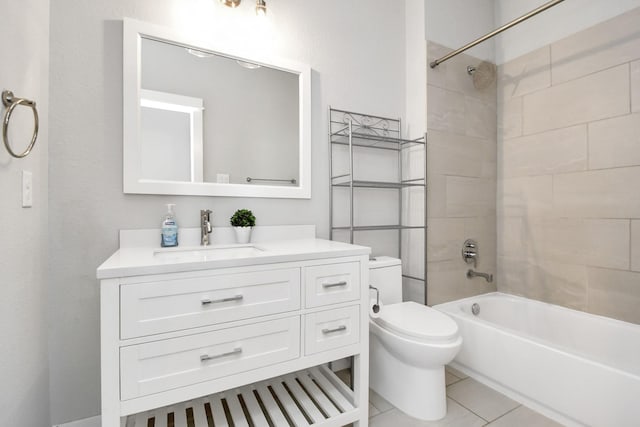 full bathroom with tile patterned flooring, vanity, toilet, and tiled shower / bath