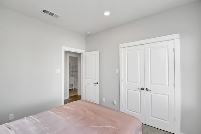 unfurnished bedroom with a closet and carpet floors