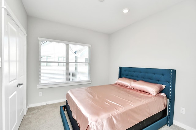 bedroom with light carpet