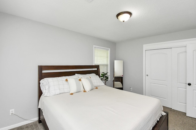 carpeted bedroom with a closet