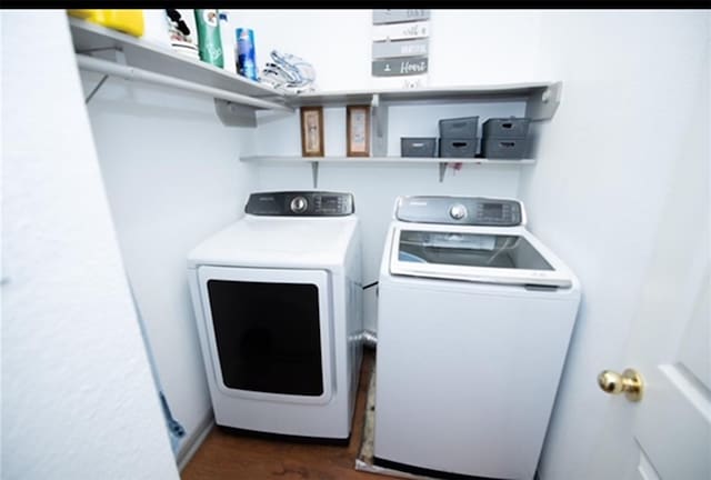 laundry room with washing machine and dryer