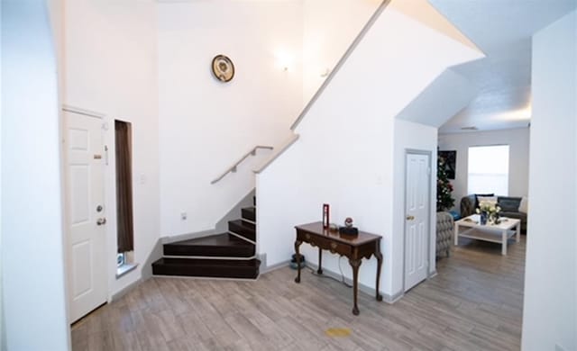 stairway featuring hardwood / wood-style floors