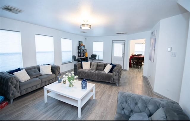 living room with dark hardwood / wood-style flooring