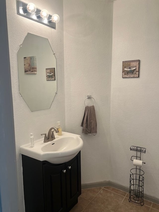 bathroom with tile patterned flooring and vanity