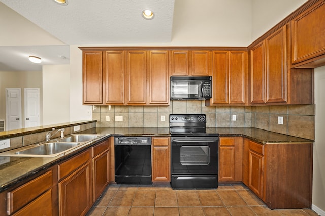 kitchen with black appliances, backsplash, sink, and tile patterned flooring