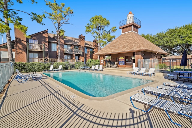 view of swimming pool with a patio area