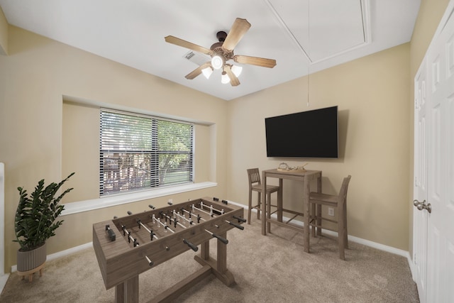 rec room with light carpet and ceiling fan