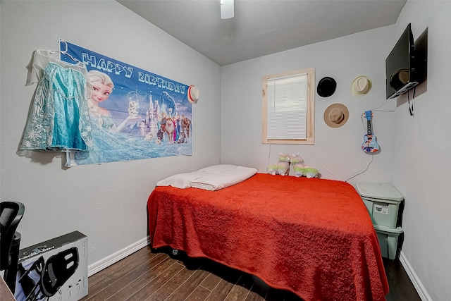 bedroom with ceiling fan and dark hardwood / wood-style floors