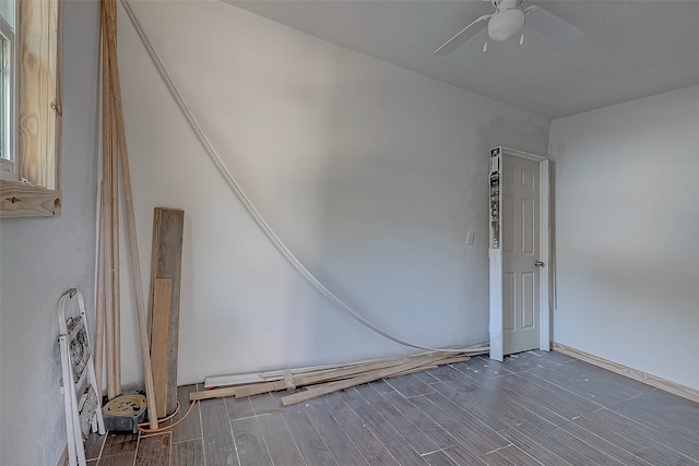 unfurnished room with ceiling fan and dark hardwood / wood-style floors