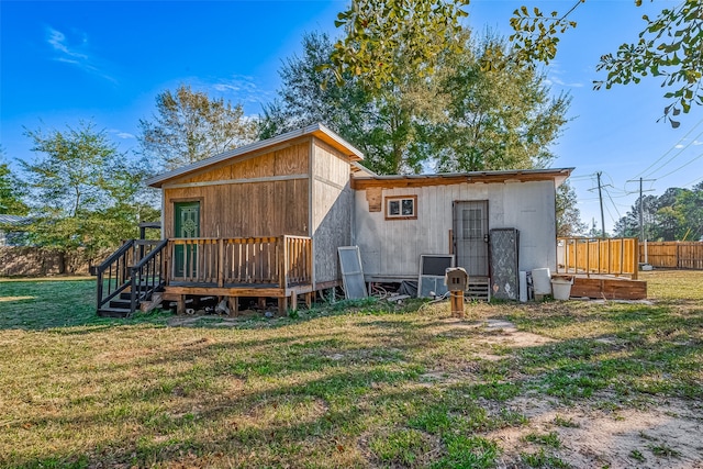 back of property with a lawn