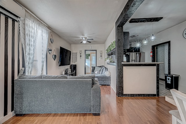 living room with hardwood / wood-style flooring and ceiling fan