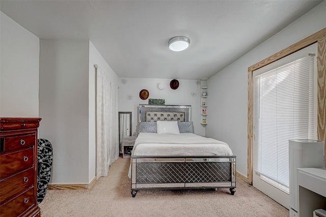 bedroom featuring light carpet