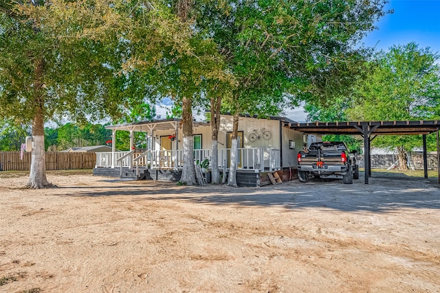 view of front of property featuring a carport