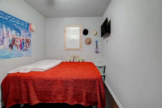 bedroom with hardwood / wood-style flooring