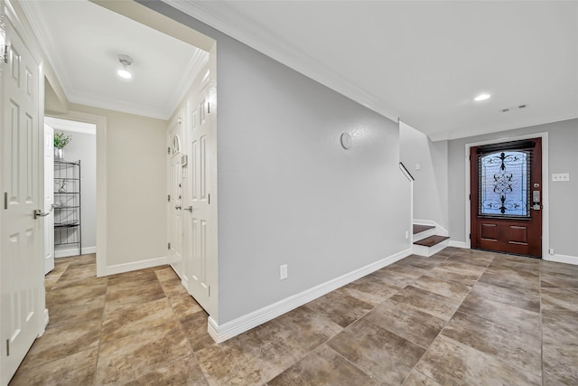 entryway featuring ornamental molding