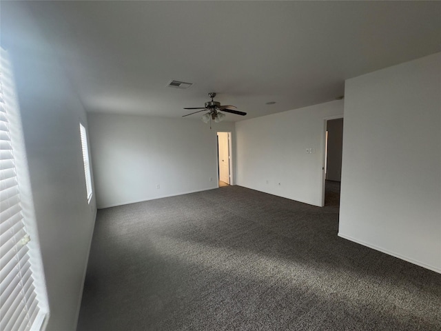 empty room with carpet floors and ceiling fan