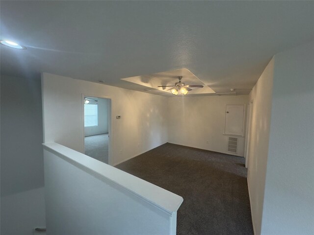 carpeted empty room with ceiling fan