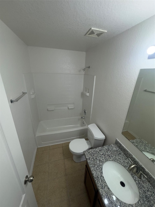 full bathroom featuring vanity, bathtub / shower combination, a textured ceiling, and toilet