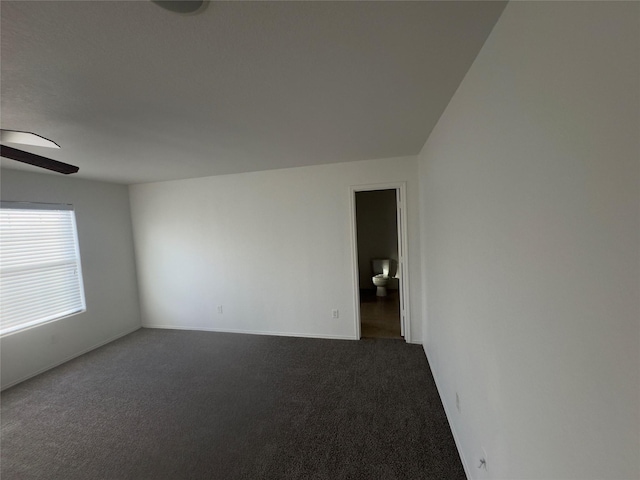 unfurnished room featuring carpet flooring and lofted ceiling