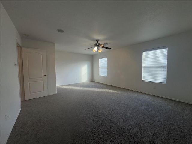 unfurnished room featuring carpet and ceiling fan