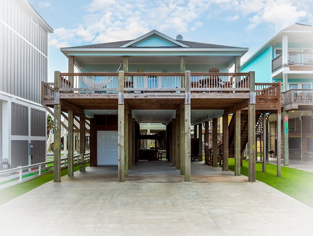 raised beach house featuring a carport