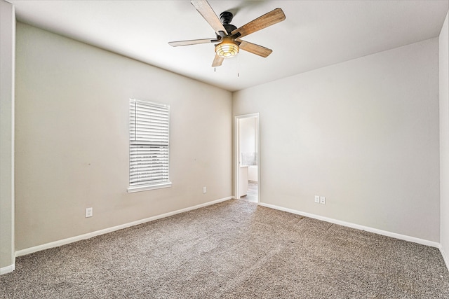 spare room with ceiling fan and carpet floors