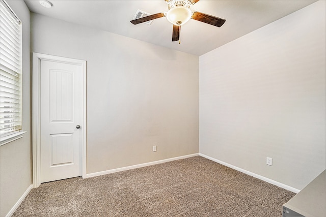 carpeted empty room with a healthy amount of sunlight