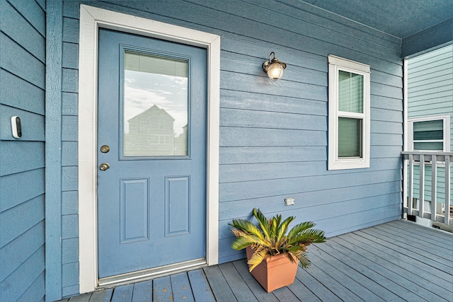 doorway to property featuring covered porch