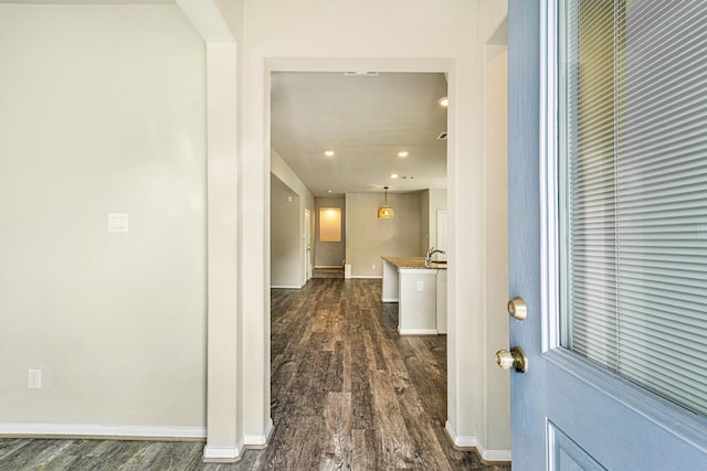 hallway featuring dark hardwood / wood-style flooring