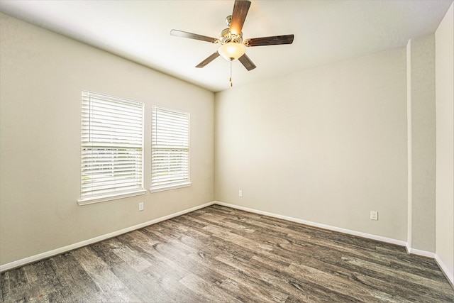 empty room featuring ceiling fan and dark wood-type flooring