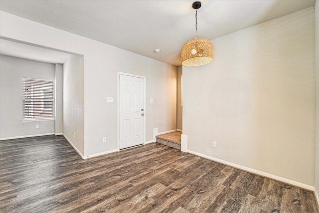 spare room featuring dark wood-type flooring